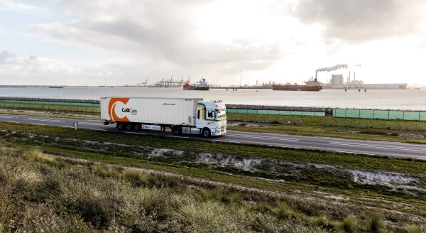 A van der Stek truck driving with a ColliCare container at the Maasvlakte, Rotterdam, Netherlands.