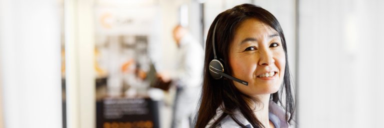 A ColliCare employee in the customer service team ready to answers questions from customers