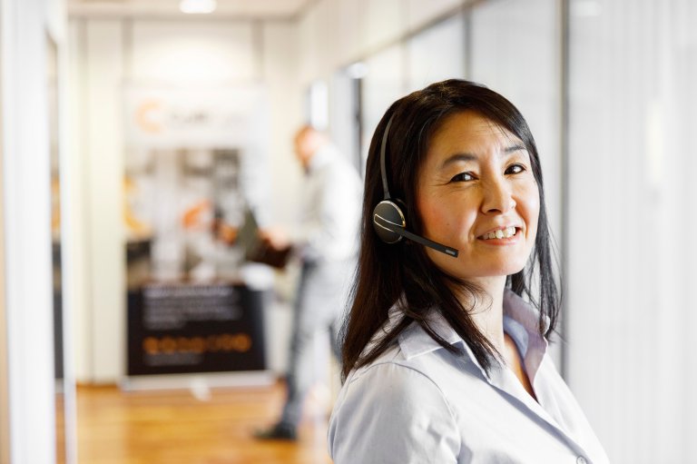 A ColliCare employee in the customer service team ready to answers questions from customers